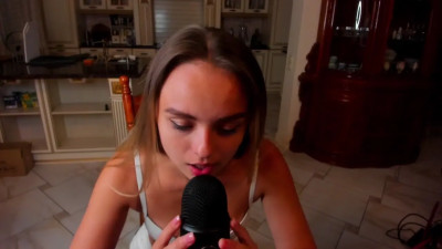 Young girl doing mouth sounds with her cat