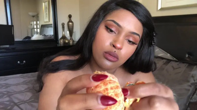 Eating fruit and honey topless in a no-talking video