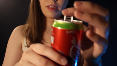 Sprinkling water on a braless top and on the tongue