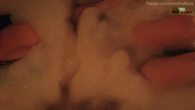 Moaning in the foamy bathtub and playing with the dildo